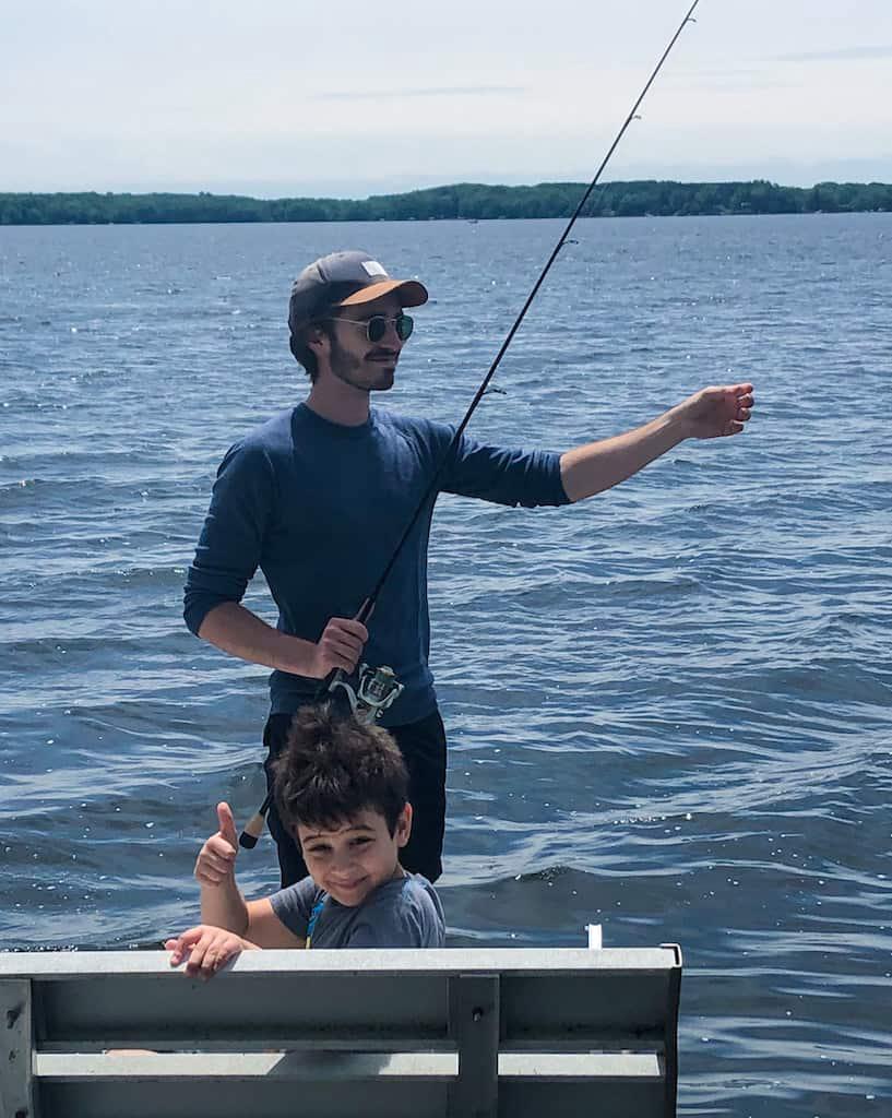 Tyler teaching his cousin how to fish